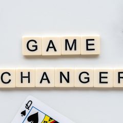 电力交易中心 电力市场规则编辑在终端前逐条比对规则文本与平台操作界面，暖橙色灯光下桌面文件整齐